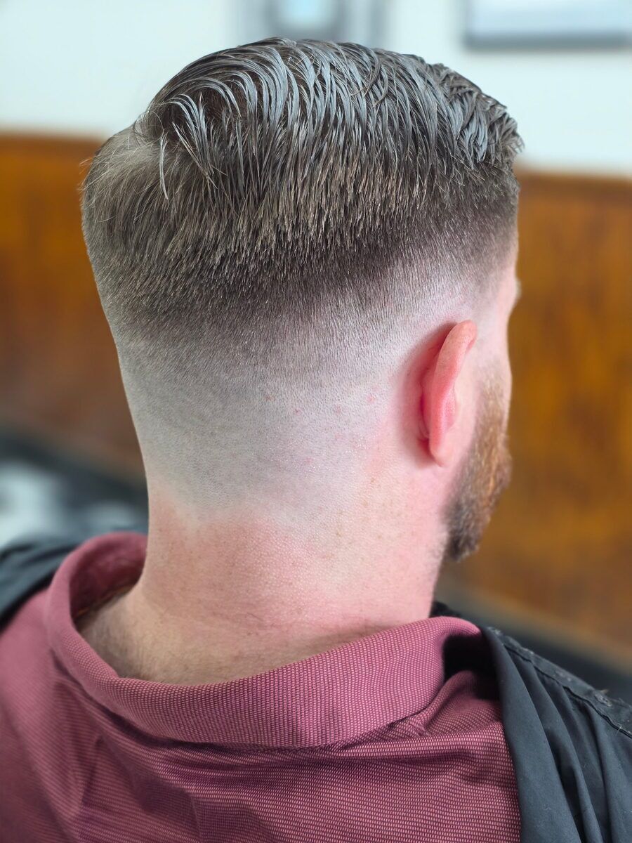 A fresh fade haircut finished at Monty's Barber Shop