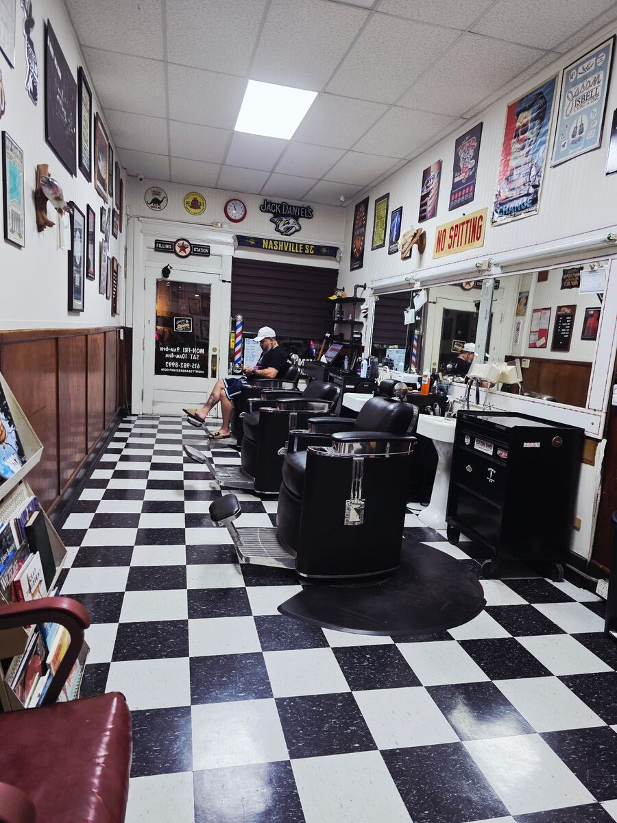 The barber chairs and checkered floor inside Monty's Barber Shop